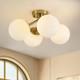 Brass 4-light Mid Century Semi Flush Mount With Milk Glass Globes