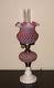 Fenton For L. G. Wright Cranberry Opalescent Honeycomb Lamp With Milk Glass Base