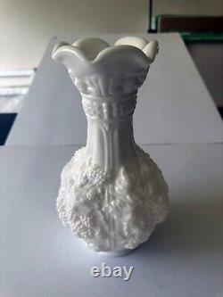 Tall milk glass flower vase with grape vine design 10.1875 inches