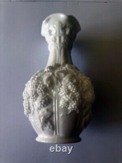 Tall milk glass flower vase with grape vine design 10.1875 inches